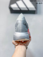 Rear view showing the gray heel construction, padded collar, and light-colored midsole.