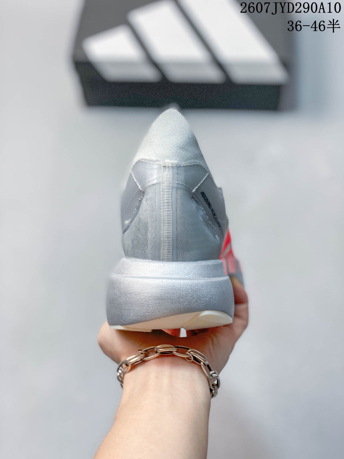 Rear view showing the gray heel construction, padded collar, and light-colored midsole.
