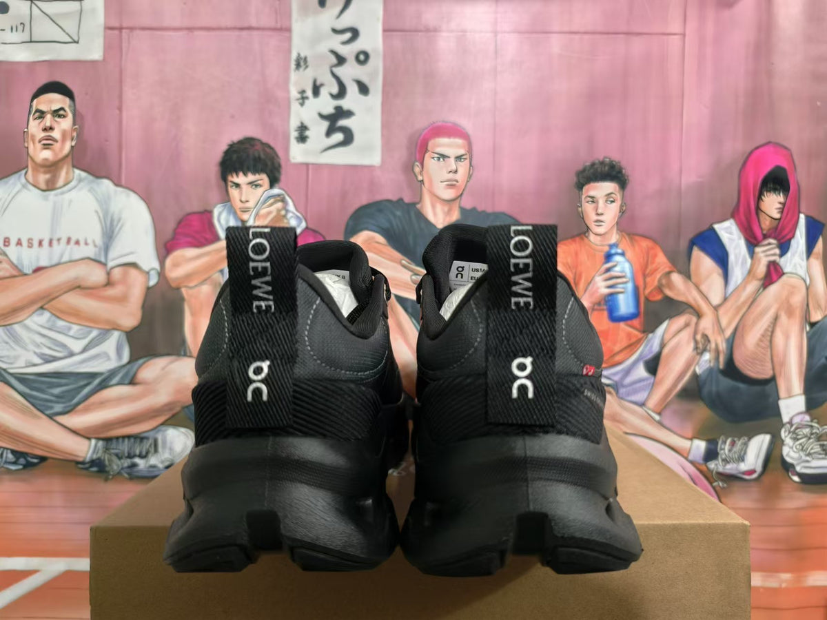 Rear view of black On Cloudtilt sneakers showing heel pull tabs and branding