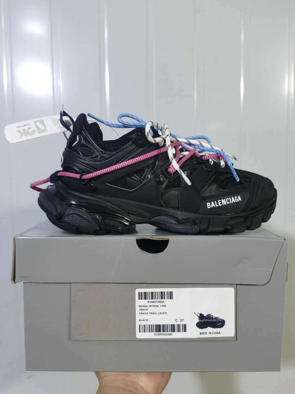 Black Balenciaga Track Trail sneaker displayed on its box, with the box label showing Track, style code 1594, black color, and size C 37.