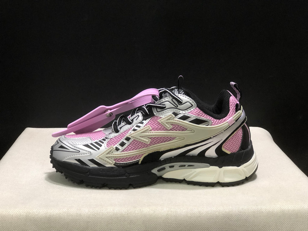 Side view of pink, black, and white OFF-WHITE Be Right Back sneakers with layered arrow-shaped side detailing.