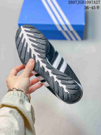 Underside view showing the textured rubber outsole and segmented tread pattern.