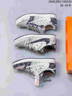 Three side views of a low-top sneaker showing white, indigo, and pale green patterned panels.