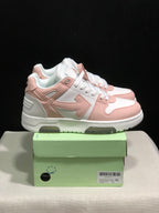 Side view of the white and pale pink low-top sneakers with layered panels, arrow motif, and green shoebox.