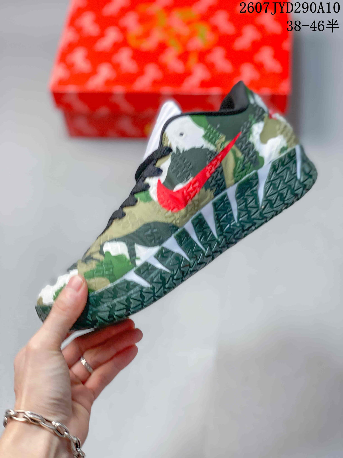 Side view showing the green camouflage-style upper, red Swoosh, and textured outsole.