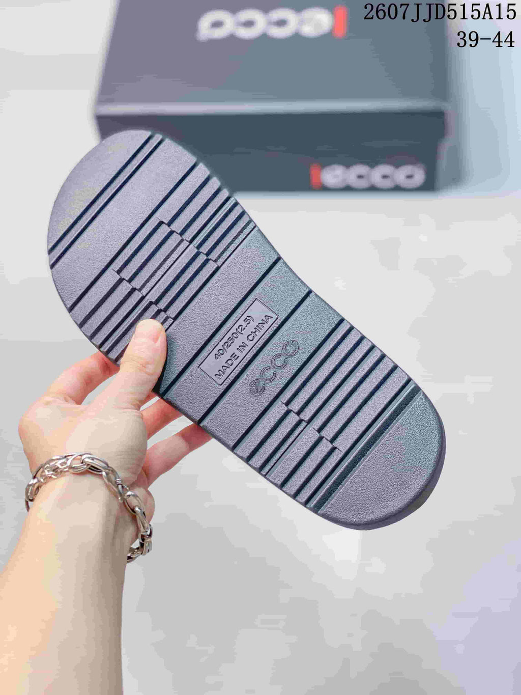 Close view of the sandal outsole showing a ribbed tread pattern and ECCO branding.