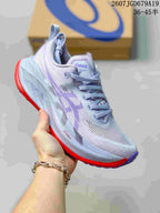 Light lavender and white ASICS SUPERBLAST 2 running shoe with a bright red outsole, shown from a front three-quarter angle.