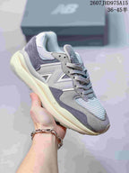 Light gray New Balance 5740 sneaker showing the mesh toe box and layered upper.
