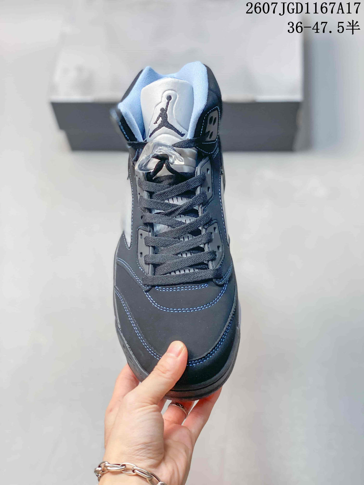 Front view of the black high-top sneaker showing the lace-up upper, padded tongue and contrasting stitching.