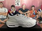 Side profile of a white Jordan basketball sneaker with dark blue outsole accents and a visible heel unit.
