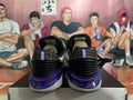 Rear view of Nike basketball shoes showing purple heel details and patterned heel panels