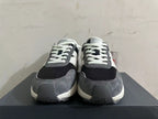 Front view showing the laces and layered toe panels of New Balance U370 sneakers