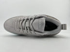 Top view showing laces, tongue branding, and patterned upper panels