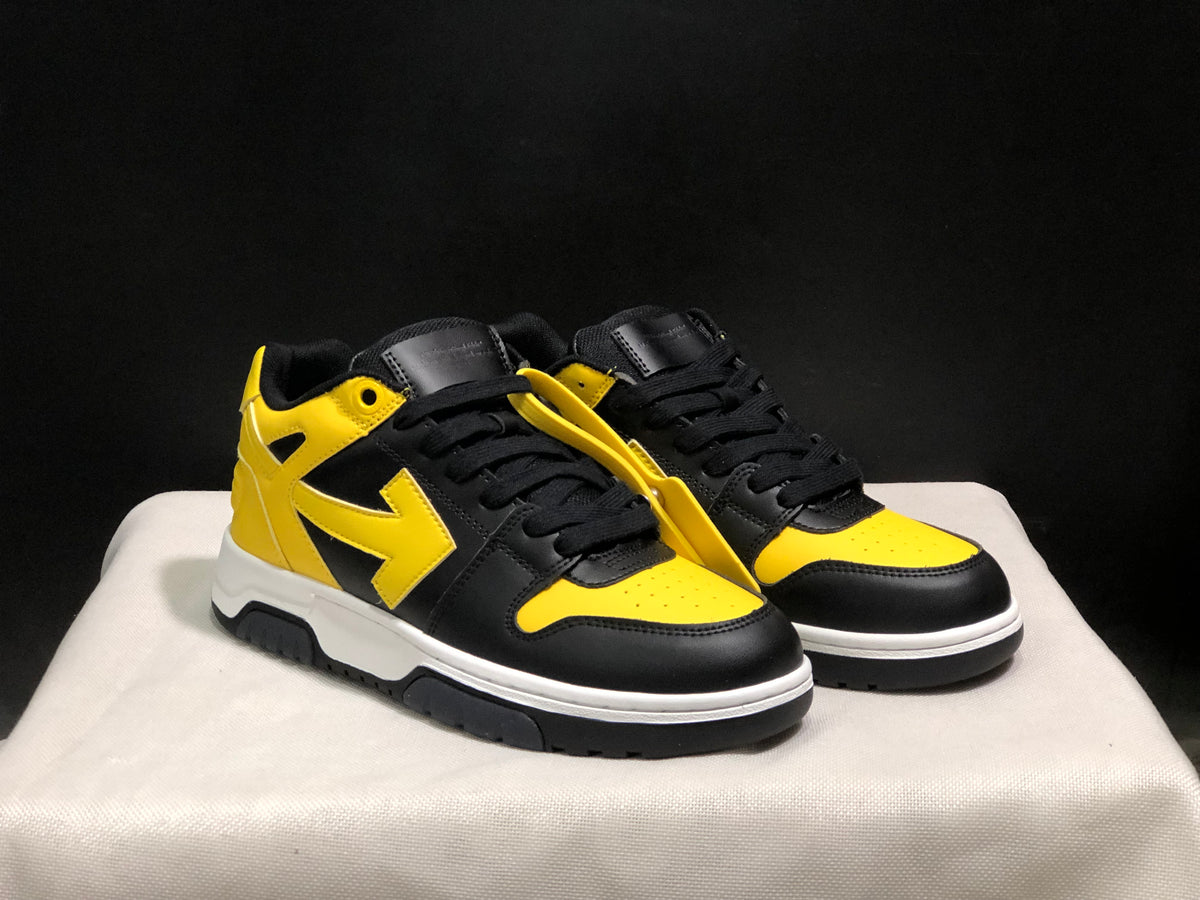 Front three-quarter view of the pair highlighting the black and yellow color blocking and lace tags.