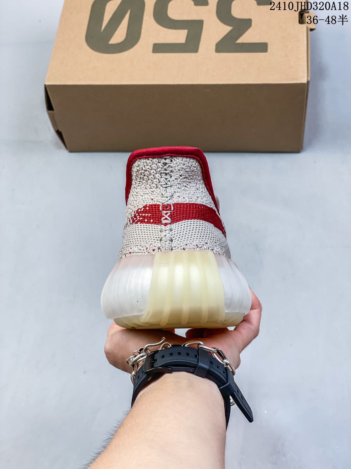 Rear view showing the red heel collar and translucent sole of the sneaker.