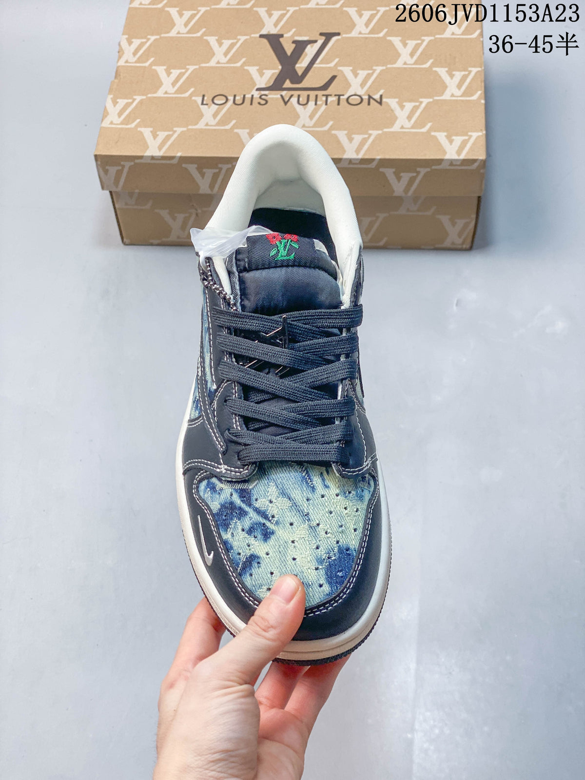 Top view showing the patterned toe, navy laces, and padded collar.