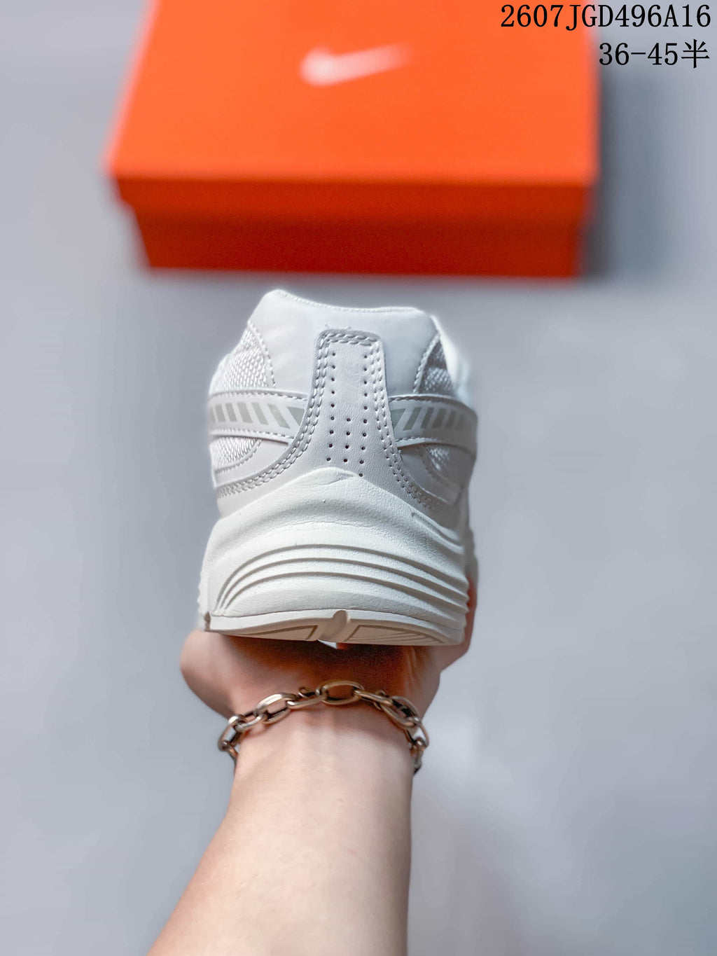 Rear view of a white and grey Nike Initiator sneaker showing the padded heel and layered sole.