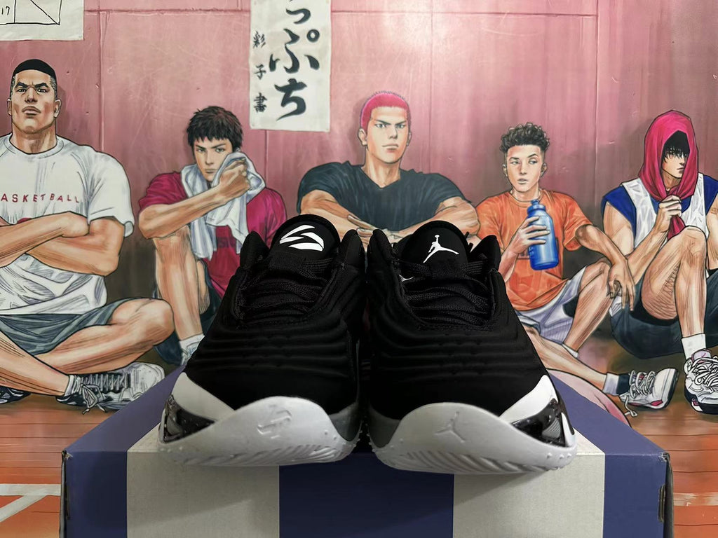 Front view of black Jordan Luka basketball shoes with white and grey accents