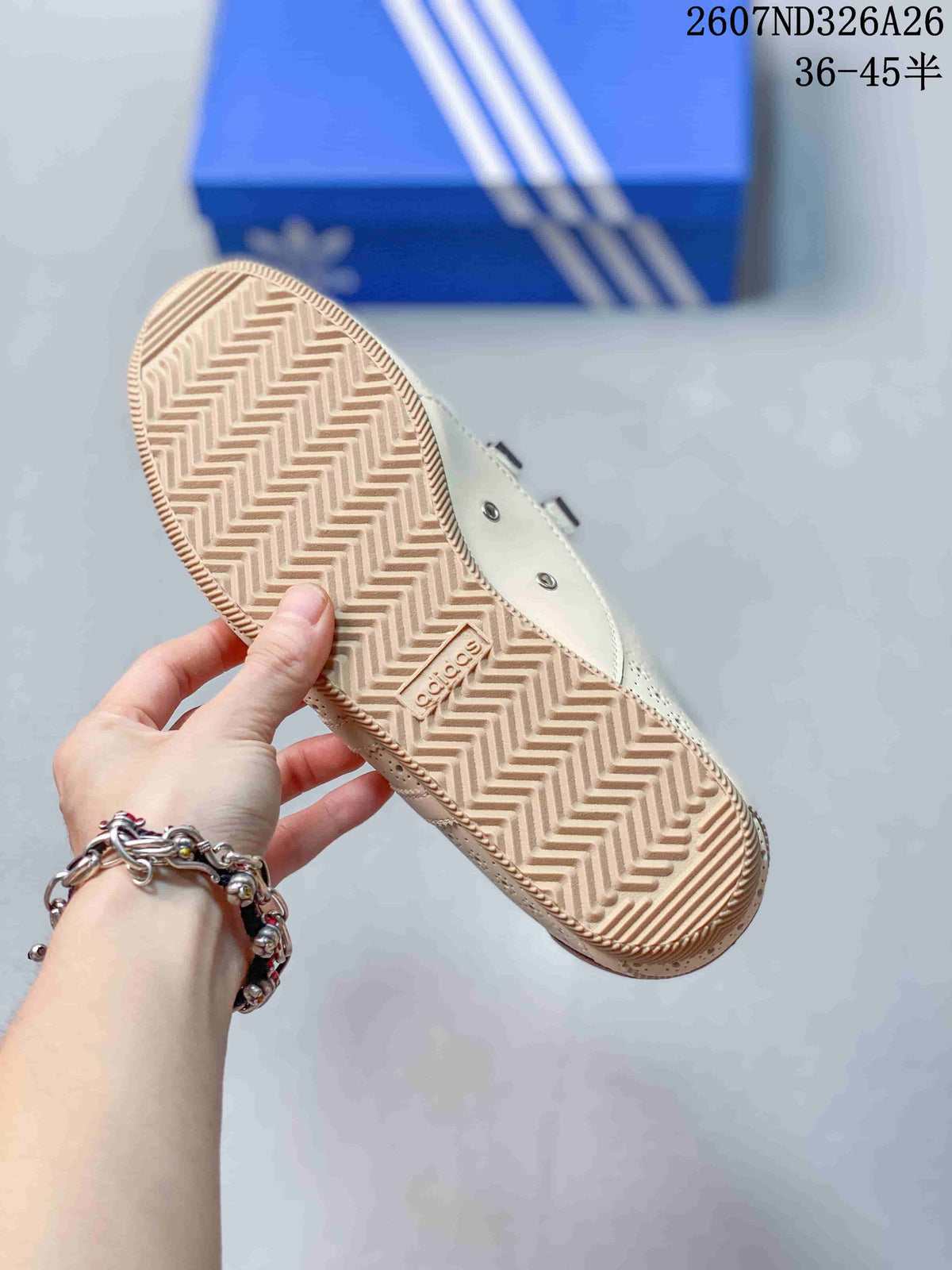 Underside of the trainer showing a textured zigzag rubber outsole and Adidas branding.