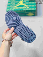 Close view of the blue rubber outsole with circular and patterned traction.