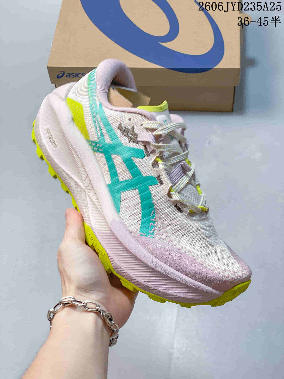 Side view of a light pink ASICS GEL-TRABUCO MAX 5 shoe with teal and lime accents