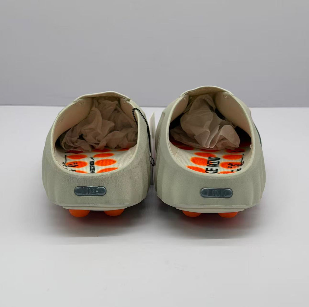 Rear view of the pair showing the open heel design and rectangular heel details.