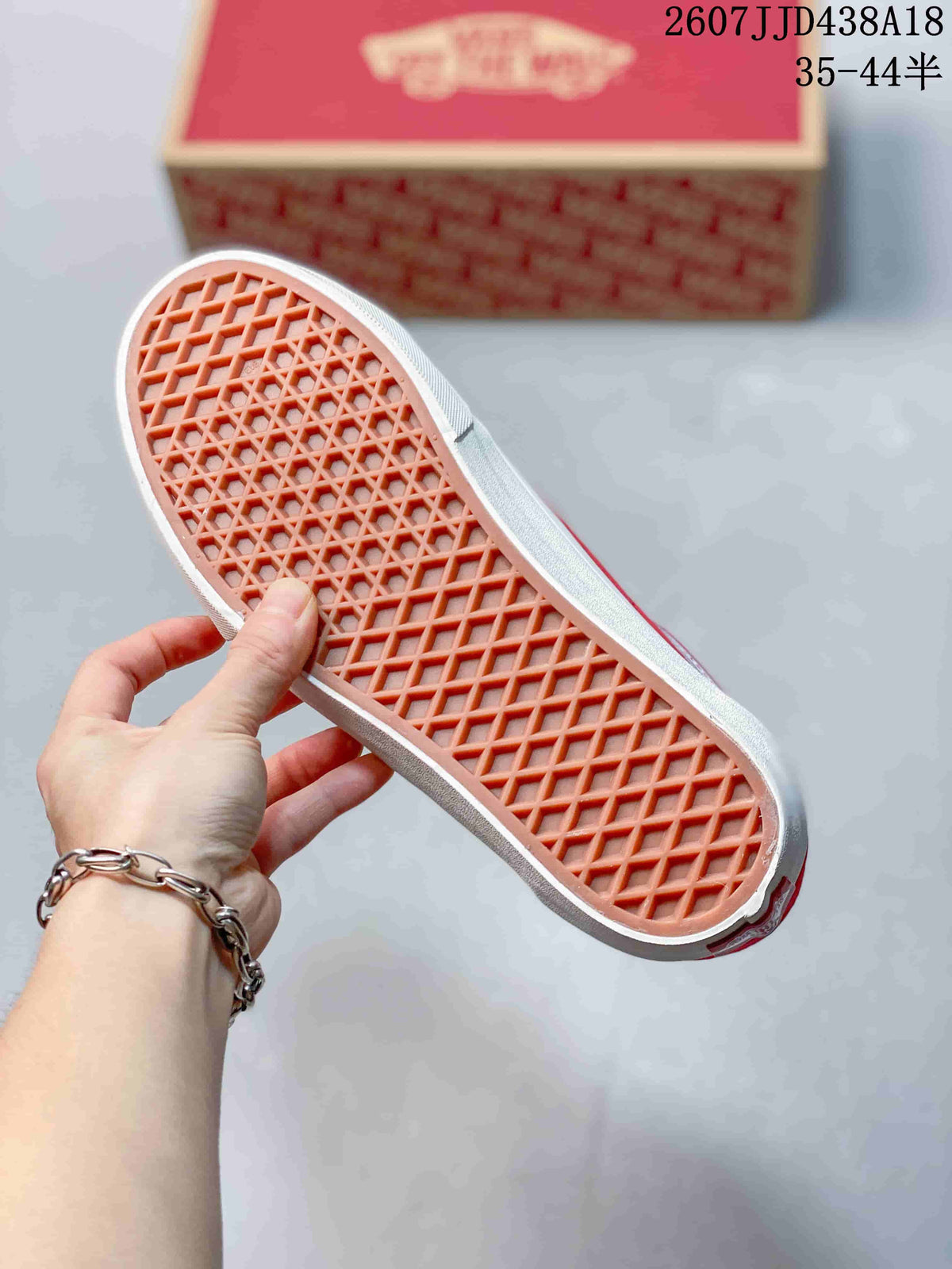 Underside of the sneaker showing the waffle-patterned outsole.