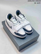 White and dark Air Jordan Legacy 312 Low sneakers shown from above