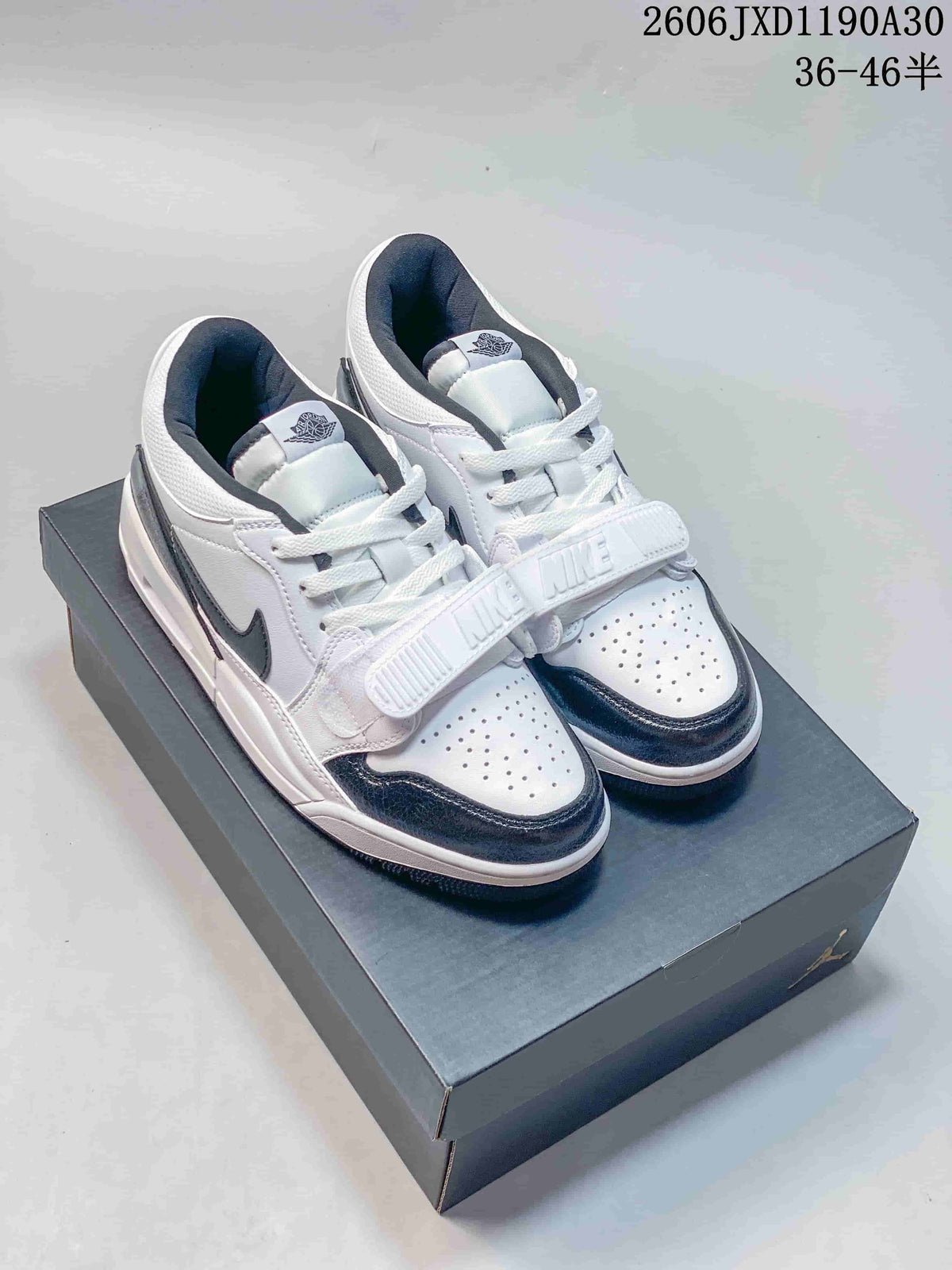 White and dark Air Jordan Legacy 312 Low sneakers shown from above