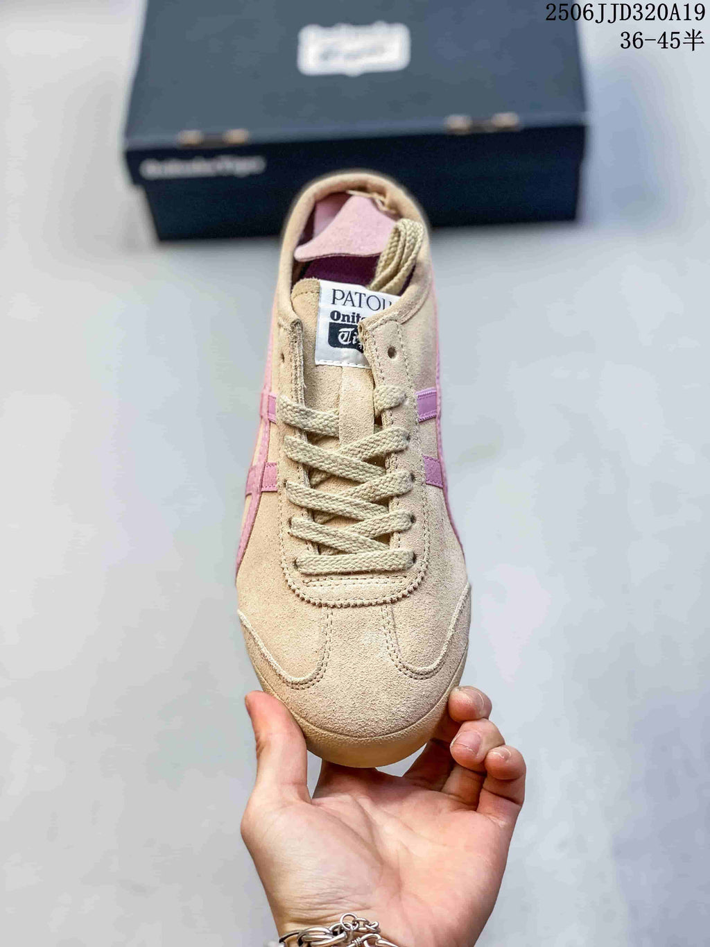 Front view showing the rounded toe, beige laces, tongue label, and pink interior details.