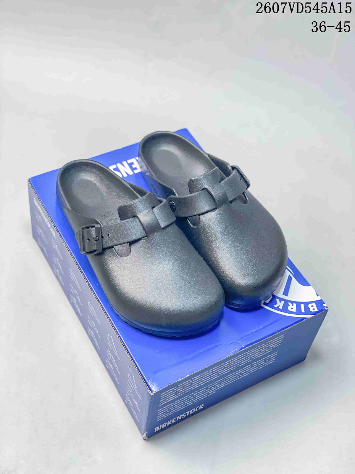Pair of black closed-toe buckle sandals displayed on a blue shoe box, with the product code and EU 36–45 range overlaid.