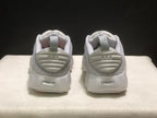 Rear view of the white sneakers showing padded heel collars, pull tabs and heel details.