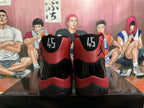 Rear view of black and red high-top sneakers showing the number 45 on both heels and Jumpman-style logos.