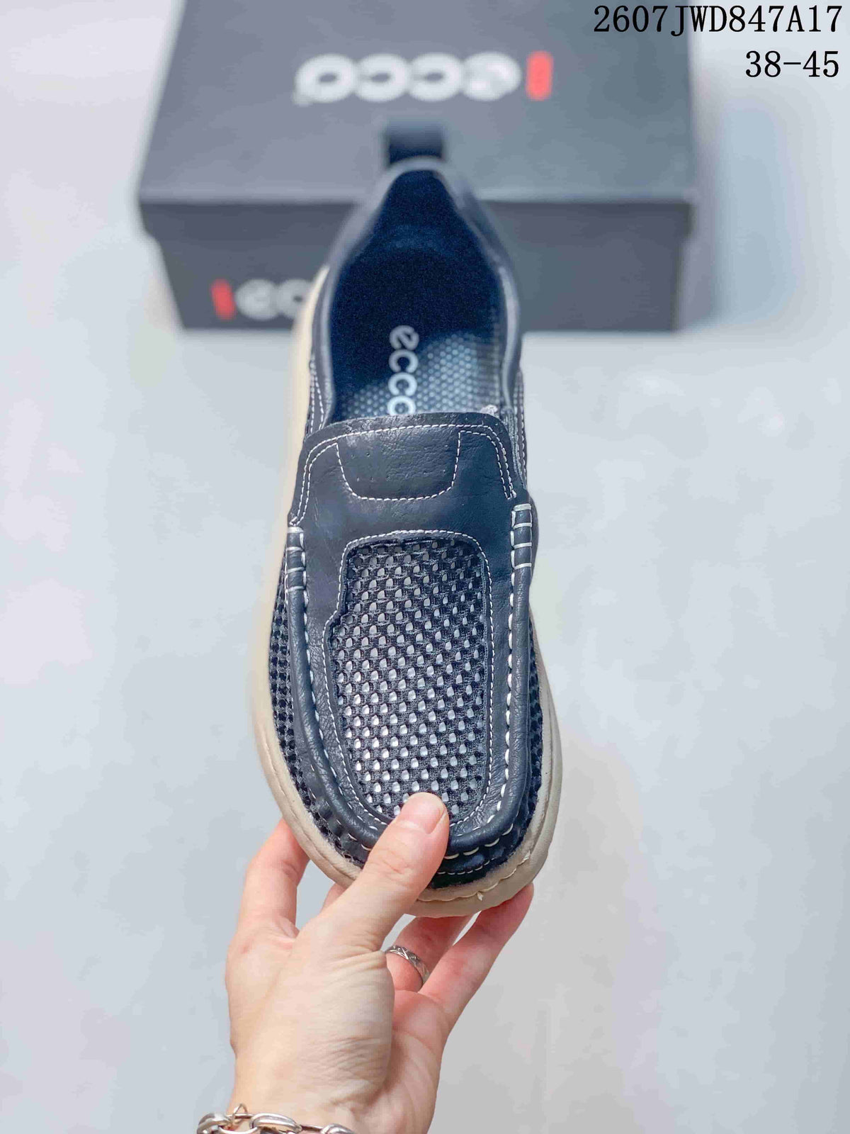 Top view of the navy slip-on shoe showing the mesh vamp, stitched panels, and branded insole.