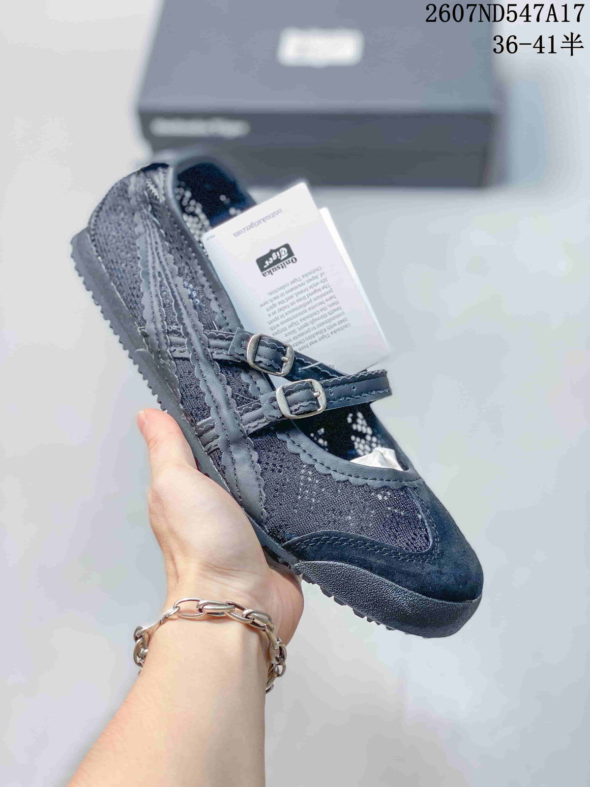 Black Mary Jane sneaker with two buckle straps, textured side stripes and a dark sole.