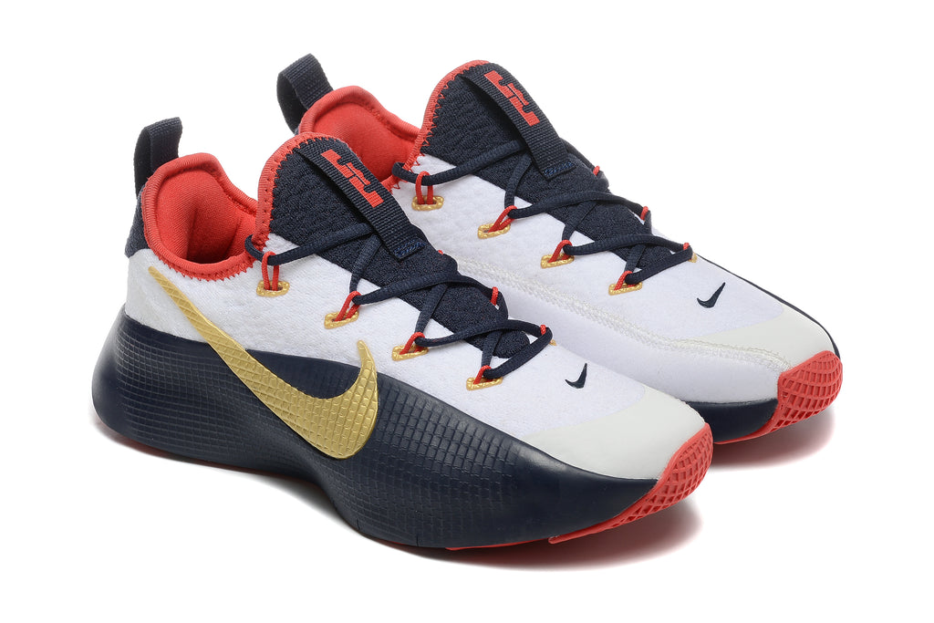 Pair of white, navy, red, and gold Nike LeBron TR1 shoes