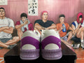 Rear view of white and purple Nike basketball shoes with a patterned midsole.