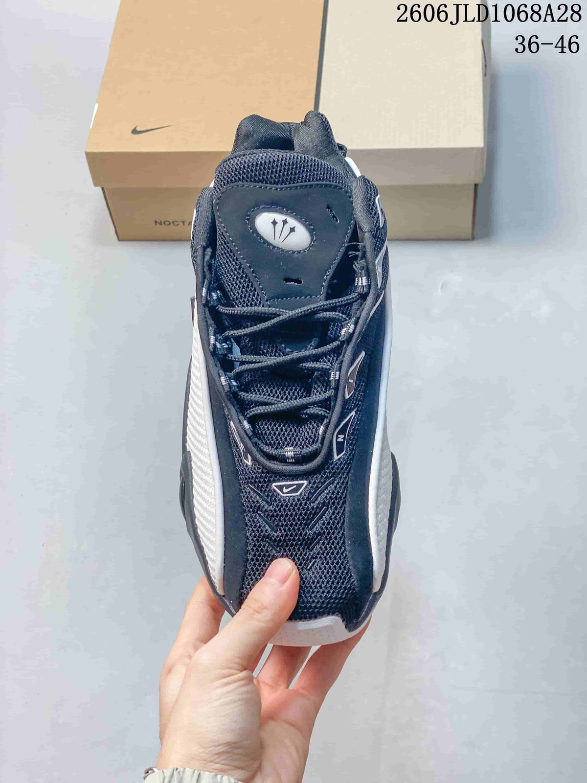 Top view of a Nike NOCTA Glide sneaker showing the mesh-look upper and laces.