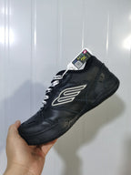 Angled view of the black Balenciaga sneaker showing the side detail, lace area, padded collar, and rubber outsole.