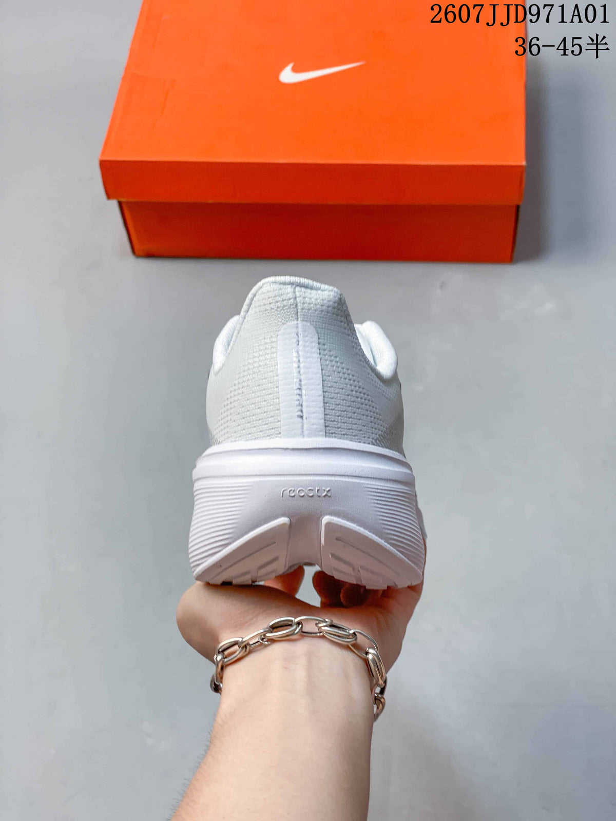 Rear view of the white running shoe with a padded heel and outsole
