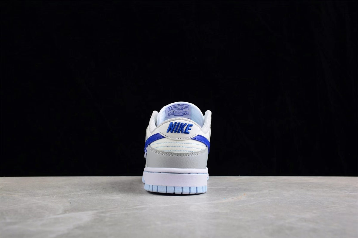 Rear view showing the padded heel, blue branding details, and light blue outsole.