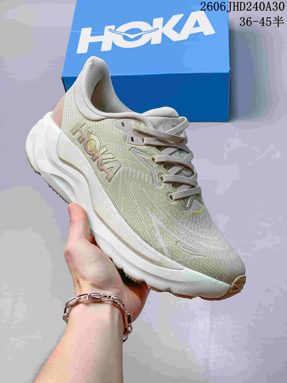 Light neutral HOKA Arahi 8 running shoe with a white sole.