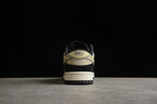 Rear view showing the beige heel accent, visible Nike branding, black heel panel, and layered outsole.