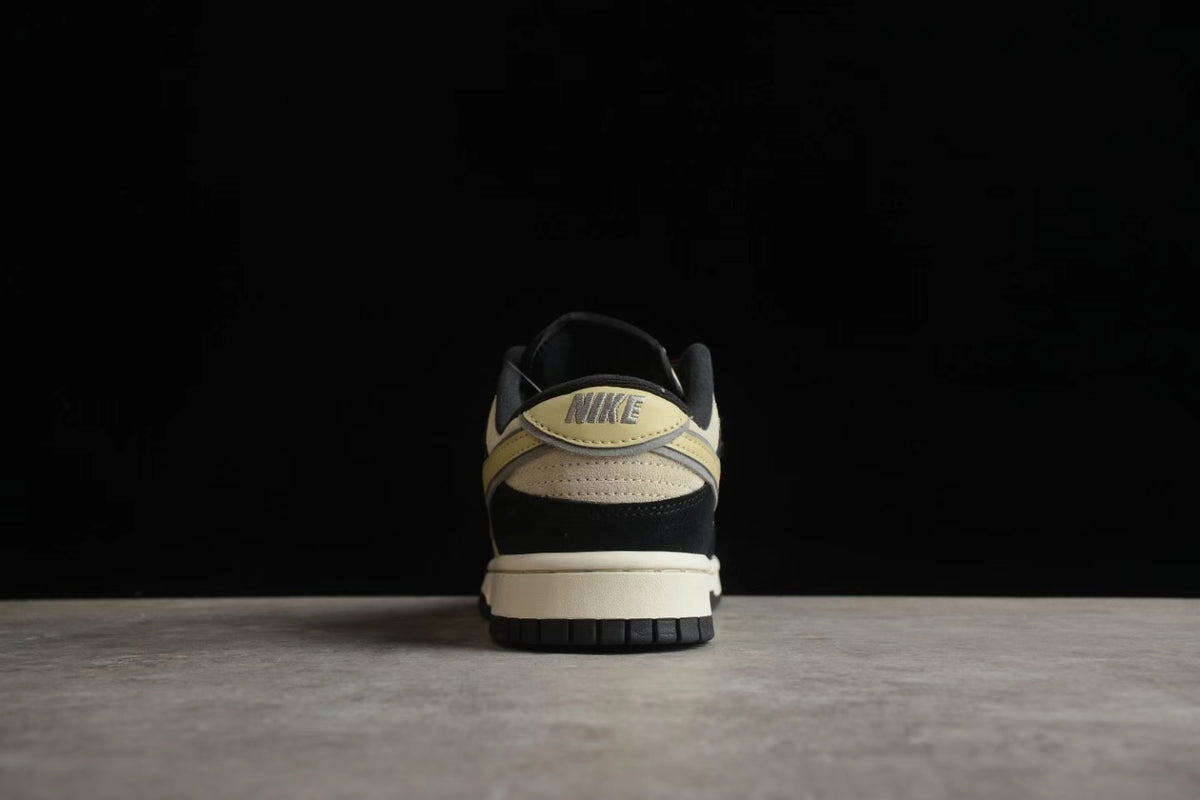 Rear view showing the beige heel accent, visible Nike branding, black heel panel, and layered outsole.
