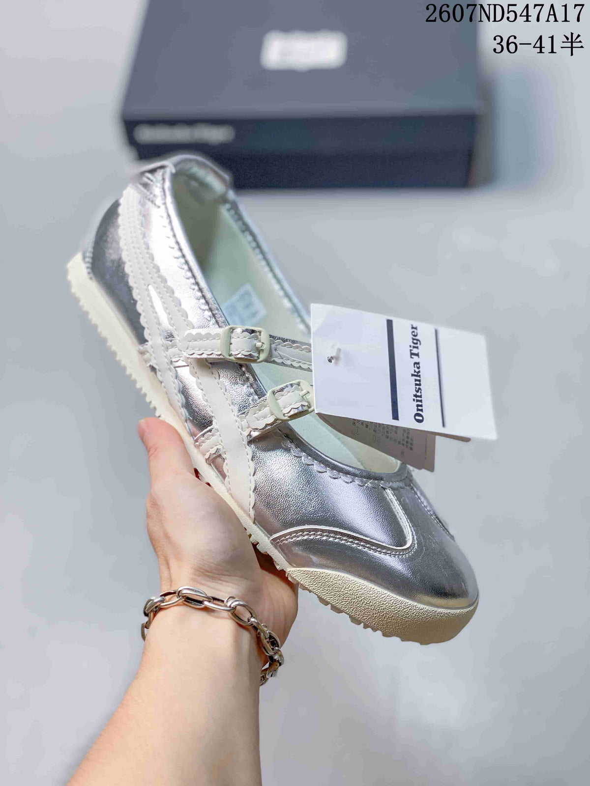 Silver metallic Mary Jane sneaker with white straps, side stripes and a light outsole.