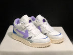 Front three-quarter view of the white sneaker pair with lavender side details, blue accents and cream-colored soles.