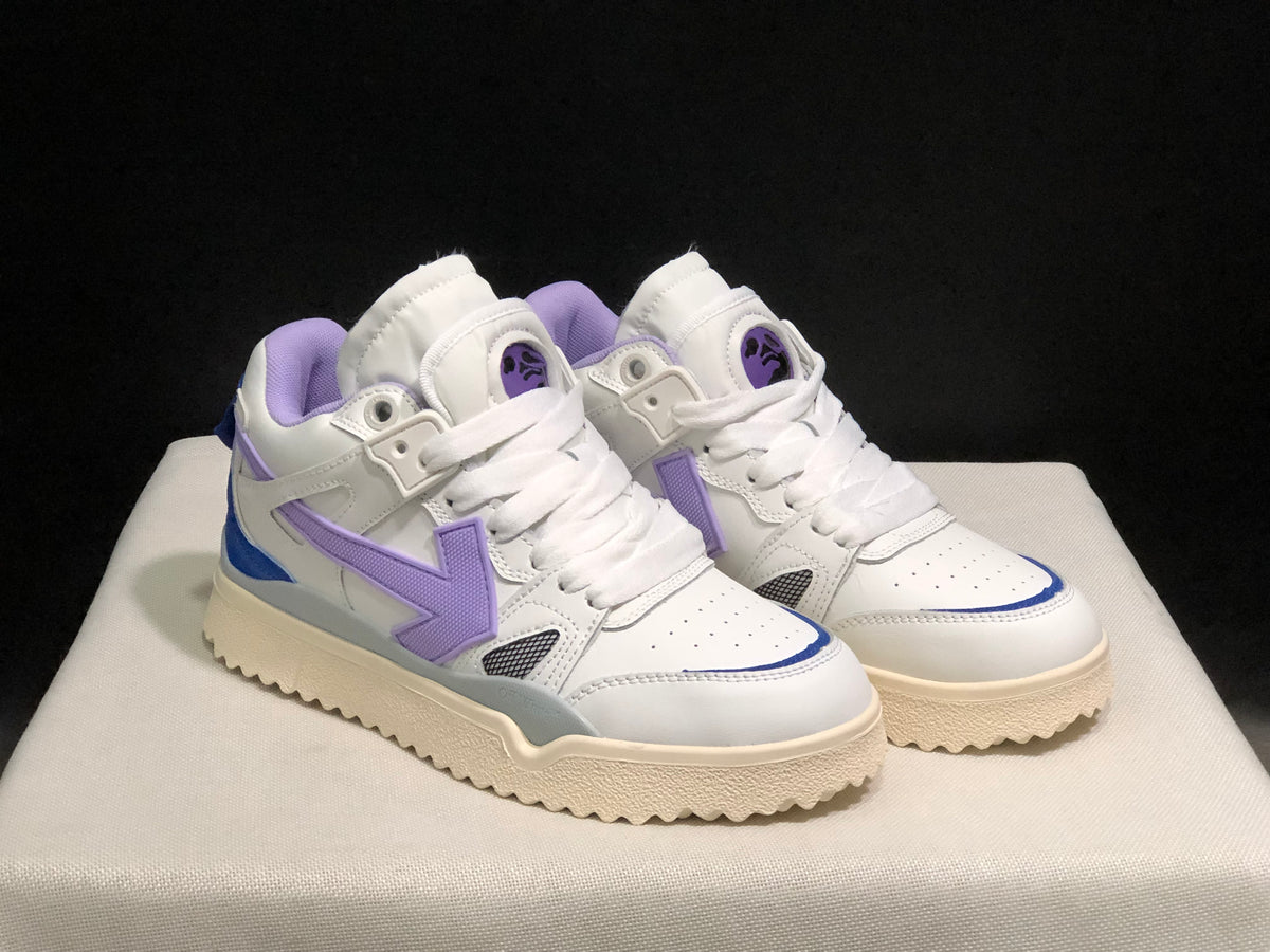 Front three-quarter view of the white sneaker pair with lavender side details, blue accents and cream-colored soles.