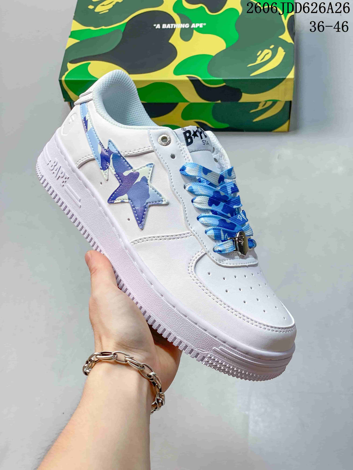 Angled side view highlighting the white upper, blue star details, patterned laces, and textured outsole.