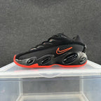 Side view of a black and red Nike Zoom Flight 95 sneaker with a dark patterned side panel.