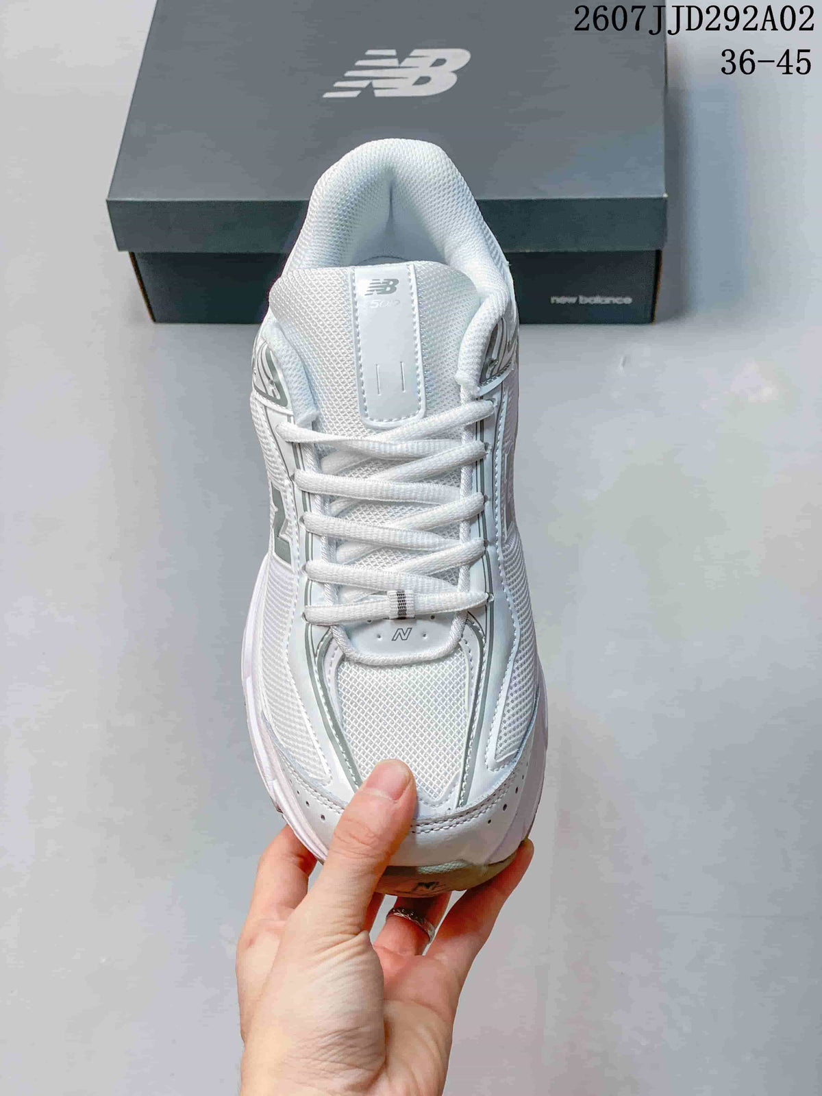 Top view of the New Balance 509 sneaker showing the mesh-textured forefoot, tonal laces and padded tongue.